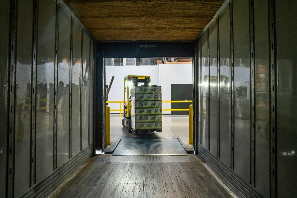 Forklift moving through a warehouse doorway