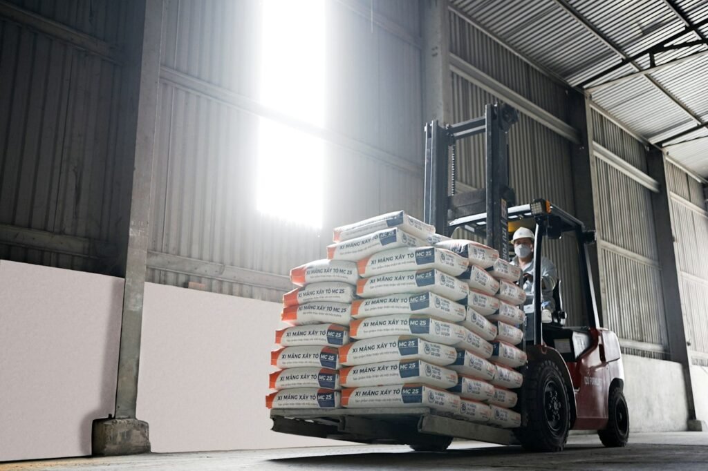 Forklift with pallet load at a rapid door opening