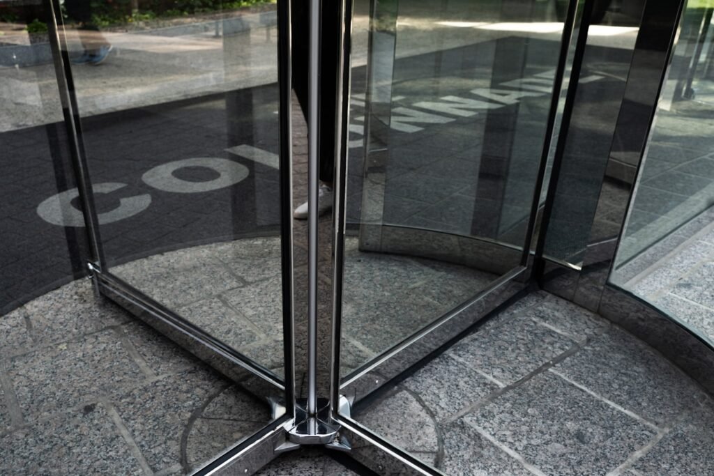 Frameless glass door with applied manifestation