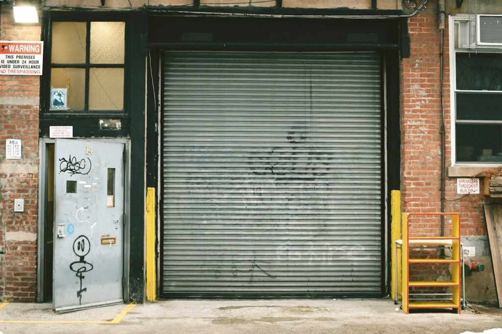 Steel roller shutter closed over a shopfront