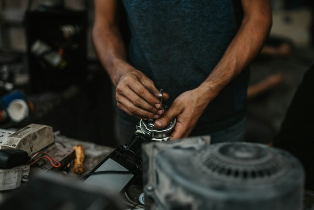 Technician with tools servicing door machinery